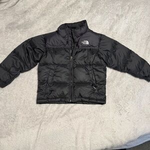 Kids The North Face light puffer jacket.